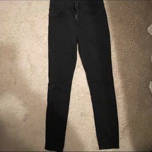 Black Topshop skinny jeans.